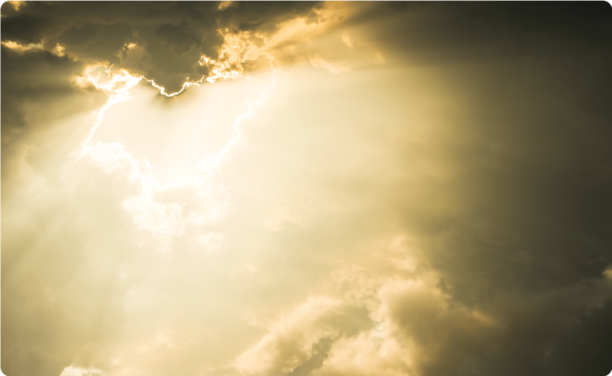 Sun rays piercing through dramatic evening clouds