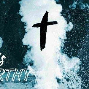 Inspirational Christian image with a cross and the text 'He is Worthy' against a blue ocean background.