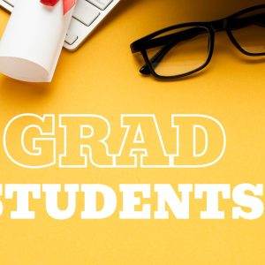 Grad students desk with glasses, tassel, globe, and paper on yellow background