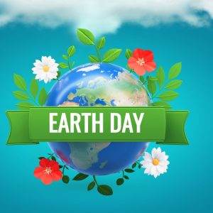 Earth Day banner with globe, green foliage, and flowers