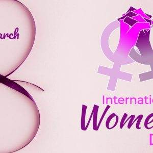 International Women's Day celebrating with purple ribbon and gender symbols on pink background.