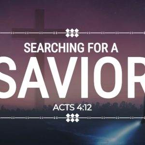 Silhouette of a person with a flashlight and a cross in the background under the text Searching for a Savior.