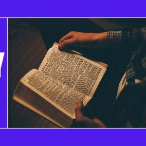 Person reading a Bible in the dark with a "Bible Study" reminder on a purple background.