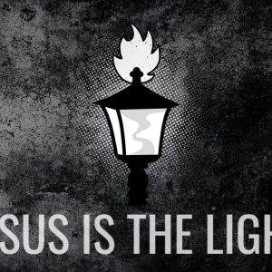 "Jesus is the light message with a glowing lantern on dark textured background"