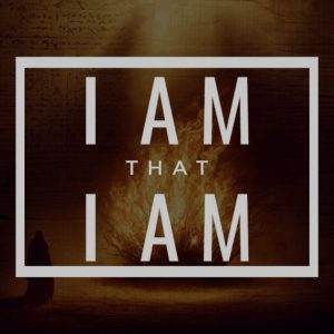 Inspirational text "I AM THAT I AM" with a dark dramatic background.