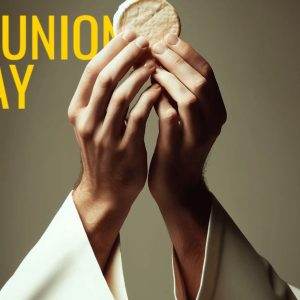 Hands holding communion wafer with Communion Sunday text