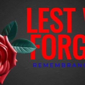 Red rose with leaves and bold text: Lest We Forget, Remembrance Day.