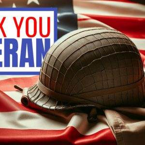 Military helmet on an American flag with a 'Thank You Veteran' sign