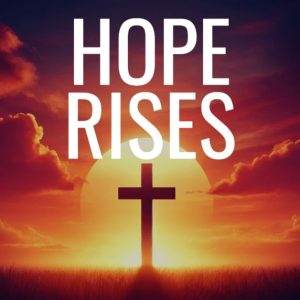 Silhouette of cross against an inspirational sunset sky with the words 'Hope Rises'