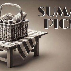 Wicker picnic basket with fresh fruits and vegetables on a wooden table.