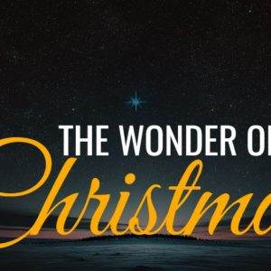 Starry night sky with bright star and text The Wonder of Christmas in elegant yellow and white fonts