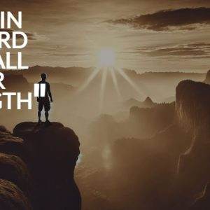 Person standing on a cliff under a dramatic sky with a quote about trusting in the Lord.