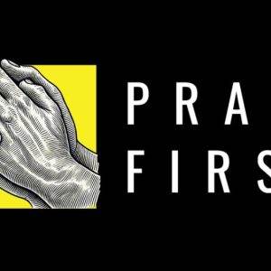 Illustration of praying hands with a yellow background and the text "Pray First" in bold white letters.