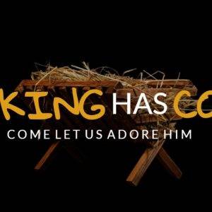 Manger with hay and the text "The King Has Come - Come Let Us Adore Him"