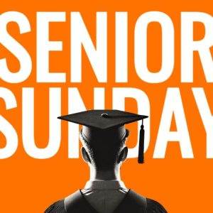 Student with graduation cap stands against a vibrant orange background with 'Senior Sunday' text.