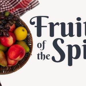 Basket of assorted fruits including apples, pears, grapes, and a lemon beside a checkered cloth and "Fruit of the Spirit" text.