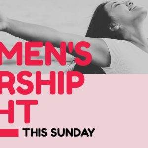 Woman joyfully embracing the sky at Women's Worship Night this Sunday