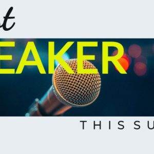 Microphone on stage with vibrant lights and text saying Guest Speaker This Sunday