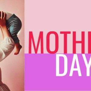 Mother lifting her happy baby in celebration of Mother’s Day with bold red and pink text in the background.