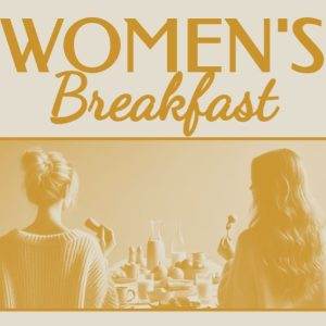 Two women enjoying a breakfast gathering with pastries and coffee.