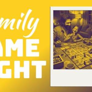 Family laughing and playing board games during cozy game night