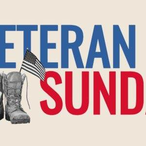 Military boots with dog tags and an American flag beside the text "Veteran Sunday."