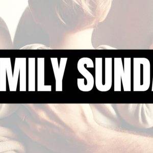 Parents holding a child with "Family Sunday" text overlay