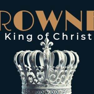 Elegant silver crown with intricate details, set against a dark background with text saying "CROWNED The King of Christmas".