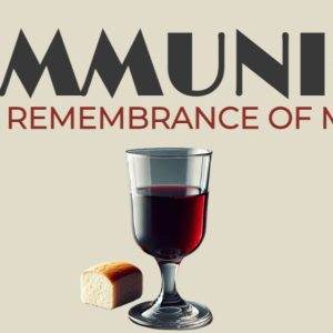 Communion with a glass of wine and a piece of bread.