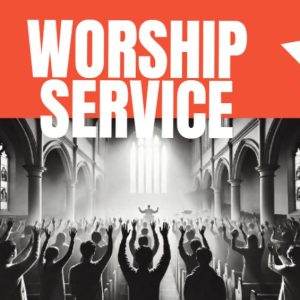 Congregation worshiping in a church with arms raised beneath banner reading 'Worship Service'