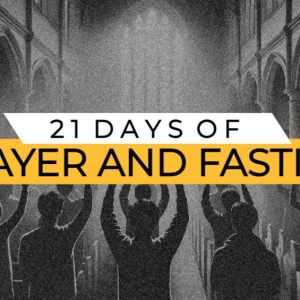 Group of people with raised hands praying in a church, “21 Days of Prayer and Fasting” text overlay.