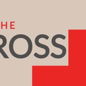 Bold graphic with 'At the Cross' text and prominent red cross symbol on a beige background.