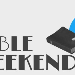 Hand holding a Bible with the text "Bible Weekend" on a white and blue background