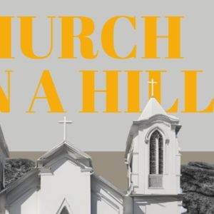 White church on a hill with bright yellow text