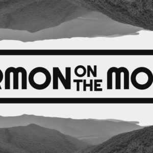 Sermon on the Mount text over a mirrored mountain landscape in grayscale.