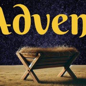 Wooden manger under a starry night sky with the word "Advent" in bold yellow letters.