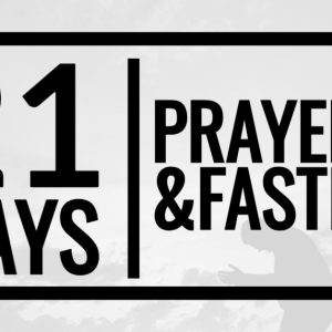 21 Days of Prayer and Fasting with a kneeling silhouette against a cloudy sky background.