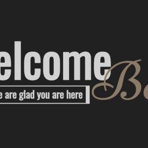 Welcome Back sign with a colorful banner and elegant typography against a black background.